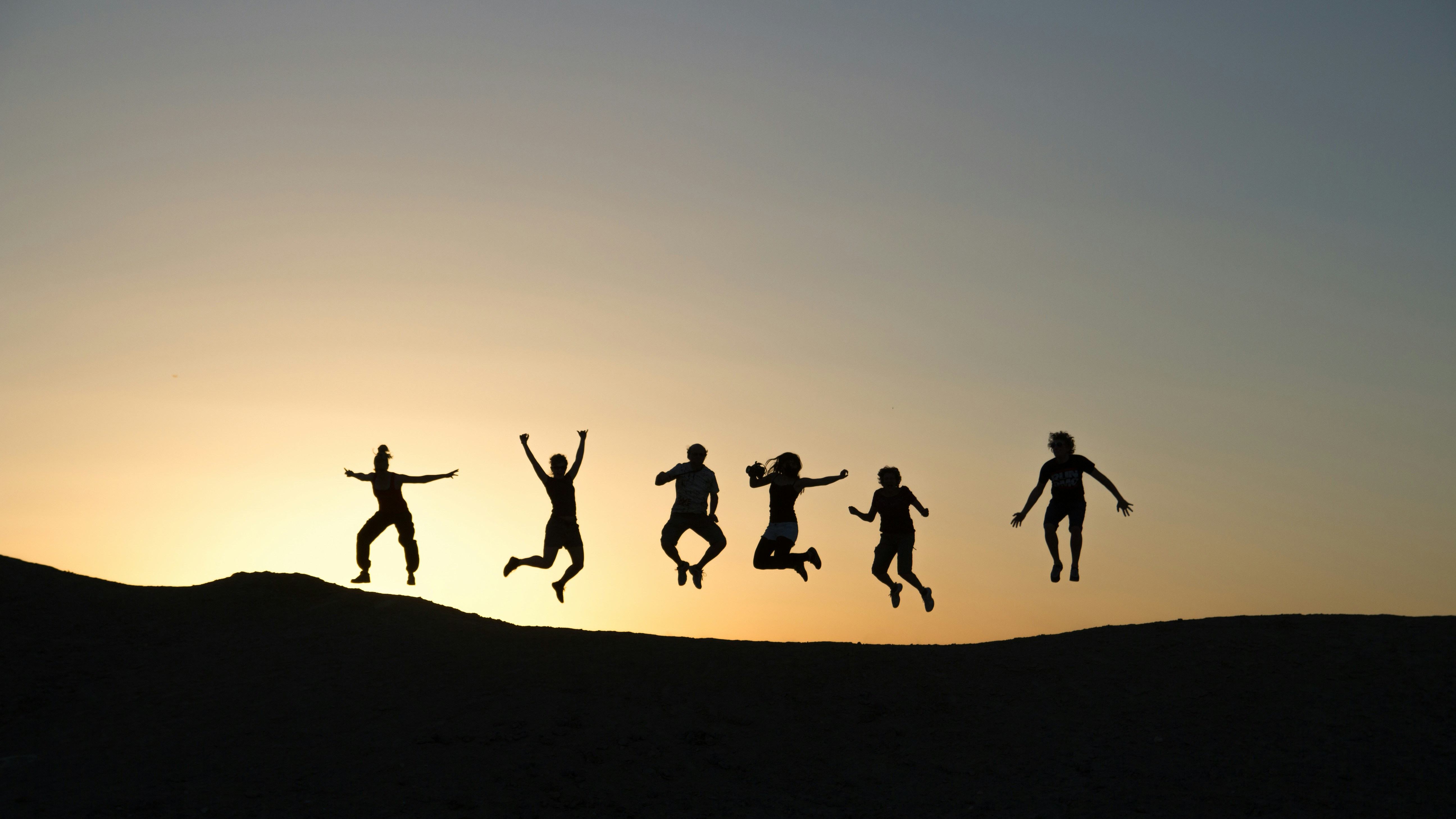 Friends walking together at sunset